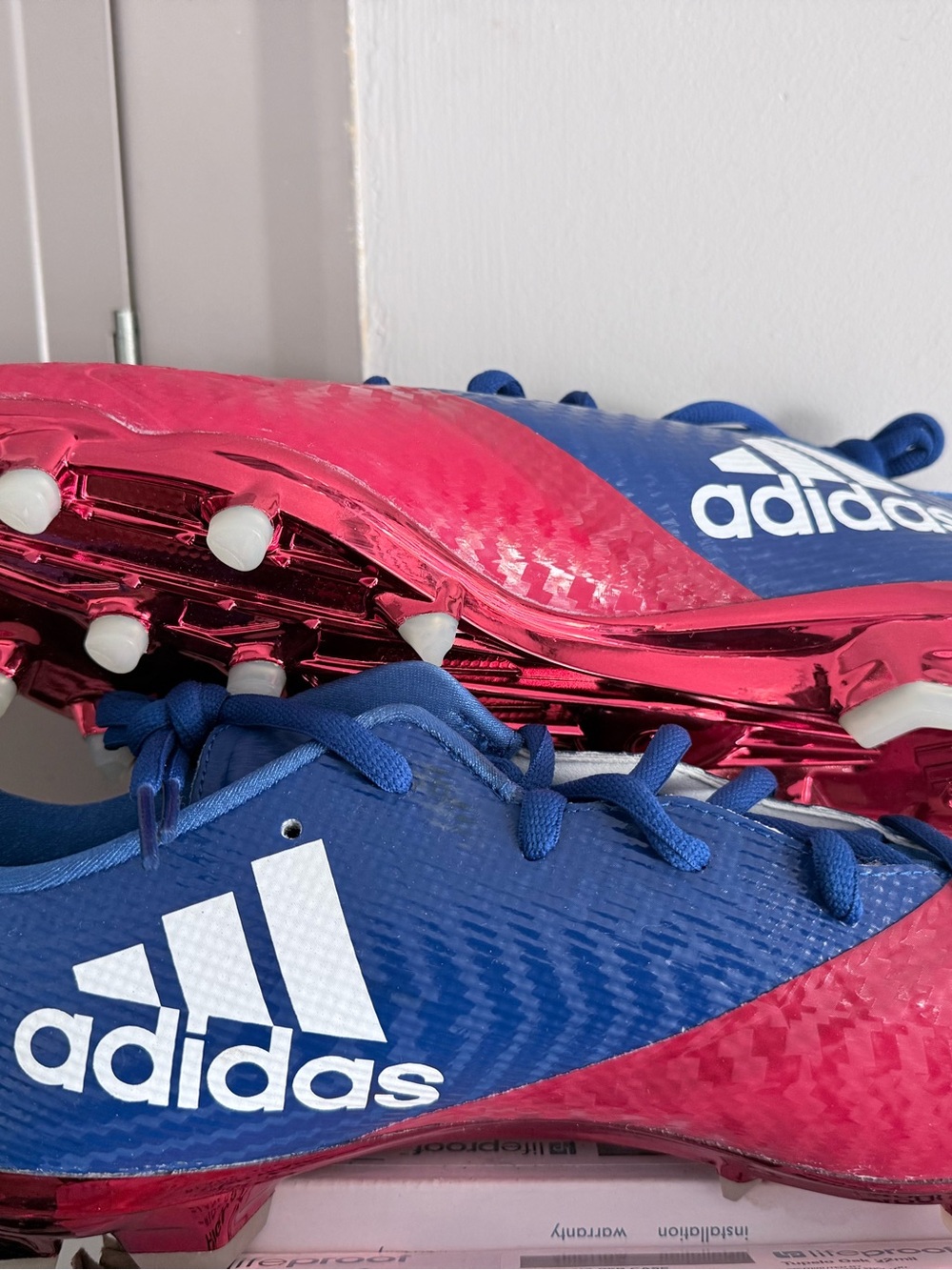 Adidas Blue and Red Cleats